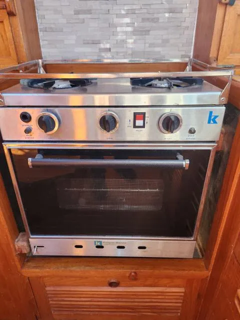 Slide: The Image of Stainless steel stove and oven on a 1982 King's Legend 41 boat. - 16
