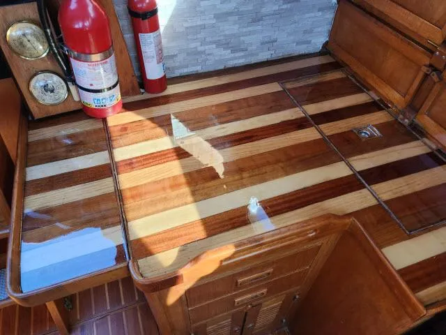 Slide: The Image of Polished wooden interior of 1982 King's Legend 41 yacht with fire extinguisher and gauges. - 17