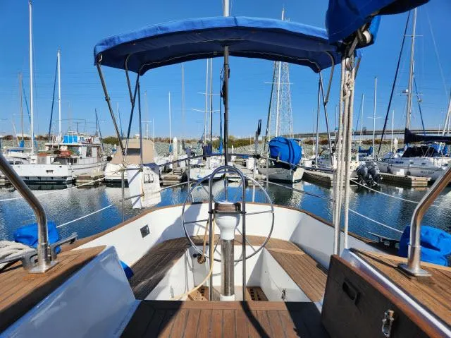 Slide: The Image of Cockpit view of 1982 Custom King's Legend 41 sailboat docked in marina. - 36