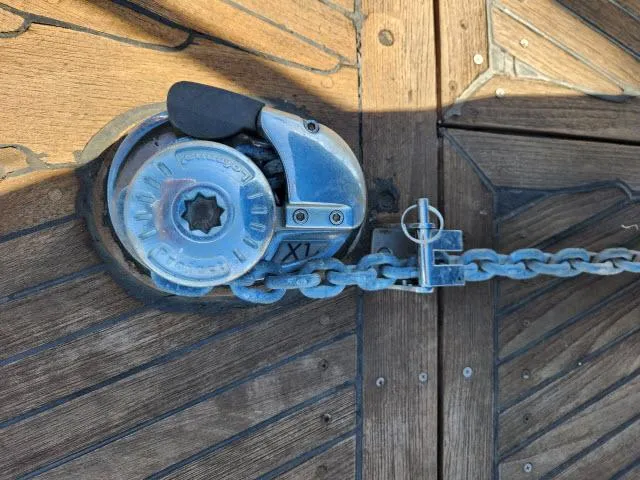Slide: The Image of Anchor windlass on 1982 Custom King's Legend 41 boat deck. - 42