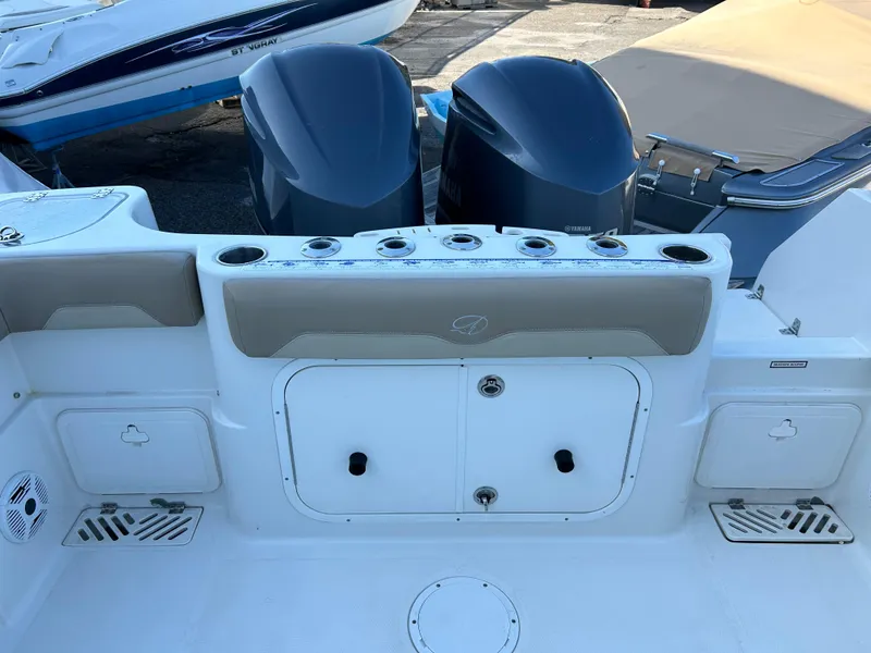 Slide: The Image of 2018 Sailfish 290 CC boat deck with dual outboard motors. - 15