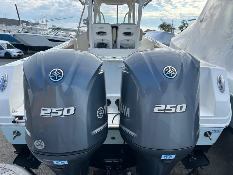 Slide: The Image of 2018 Sailfish 290 CC boat with dual Yamaha 250 outboard engines. - 19