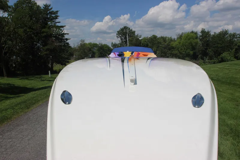Slide: The Image of 2001 Cigarette 46 Rough Rider boat on a road, viewed from the front. - 11