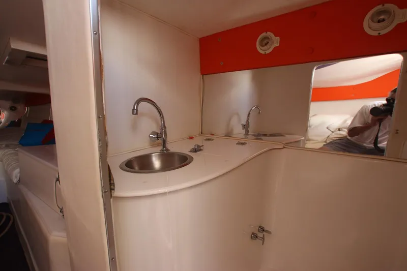 Slide: The Image of Interior of 2001 Cigarette 46 Rough Rider boat with dual sinks and mirror. - 19