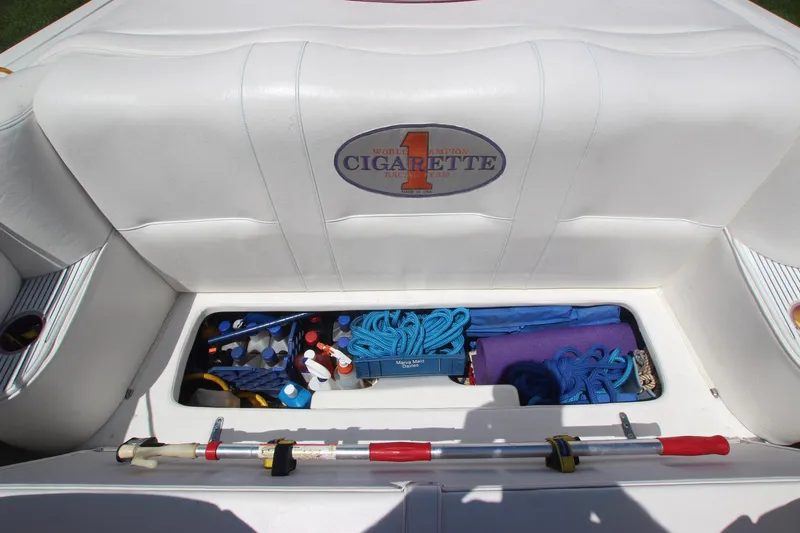 Slide: The Image of Storage compartment of 2001 Cigarette 46 Rough Rider boat with ropes and equipment. - 21