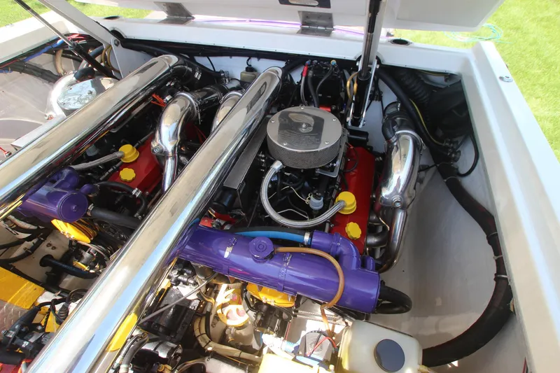 Slide: The Image of Engine compartment of a 2001 Cigarette 46 Rough Rider boat, showcasing dual engines. - 24