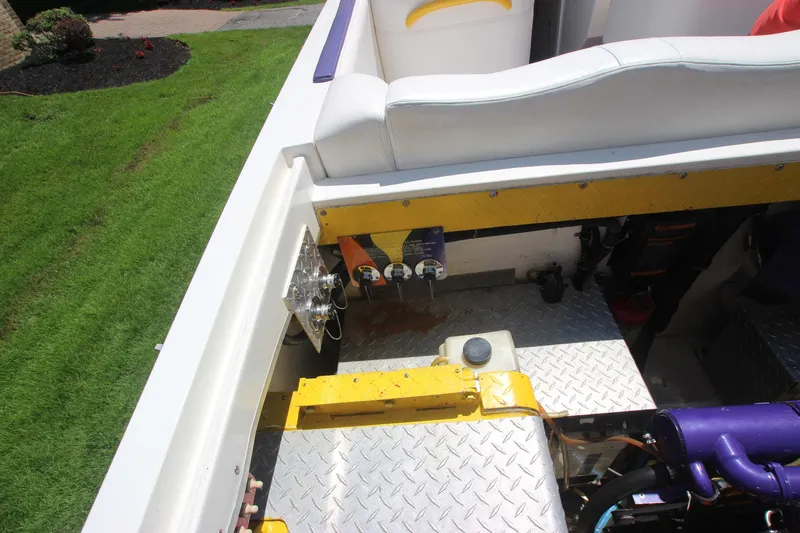 Slide: The Image of 2001 Cigarette 46 Rough Rider boat interior with engine compartment and seating area. - 25