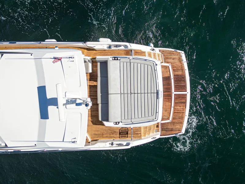 Slide: The Image of Aerial view of 2020 Sunseeker Predator 74 yacht with sun deck on open water. - 10