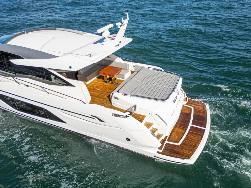 Slide: The Image of 2020 Sunseeker Predator 74 yacht cruising on open water. - 11