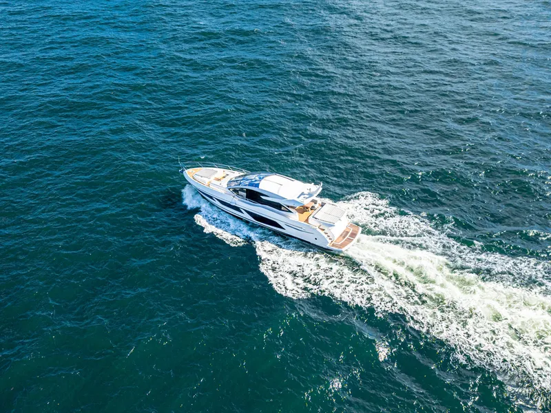 Slide: The Image of Sunseeker Predator 74 yacht cruising on open sea, 2020 model. - 14