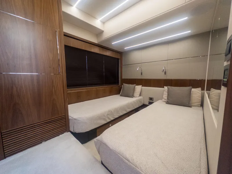 Slide: The Image of Luxurious interior of 2020 Sunseeker Predator 74 yacht with twin beds and modern design. - 21