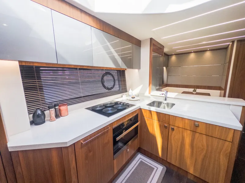 Slide: The Image of Luxurious kitchen interior of 2020 Sunseeker Predator 74 yacht with modern appliances. - 26