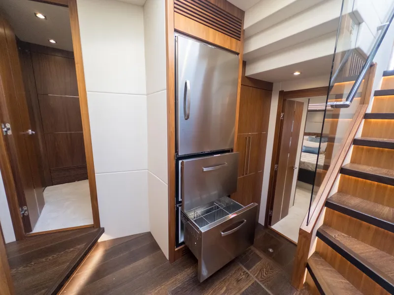 Slide: The Image of Interior of 2020 Sunseeker Predator 74 yacht with modern kitchen and stainless steel appliances. - 28