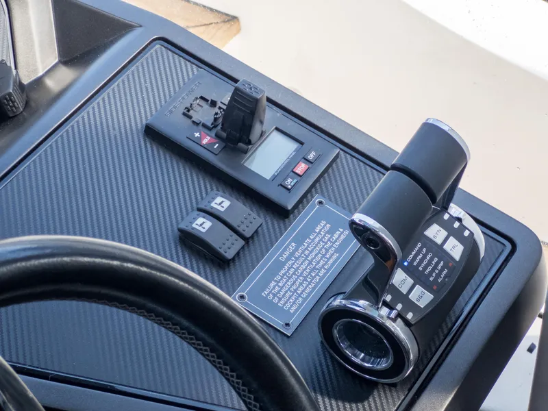 Slide: The Image of Control panel of 2020 Sunseeker Predator 74 yacht with throttle and switches. - 30