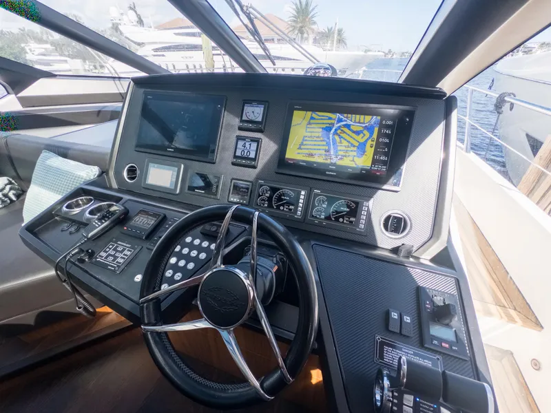 Slide: The Image of Sunseeker Predator 74 yacht helm, featuring advanced navigation and control systems, 2020 model. - 31