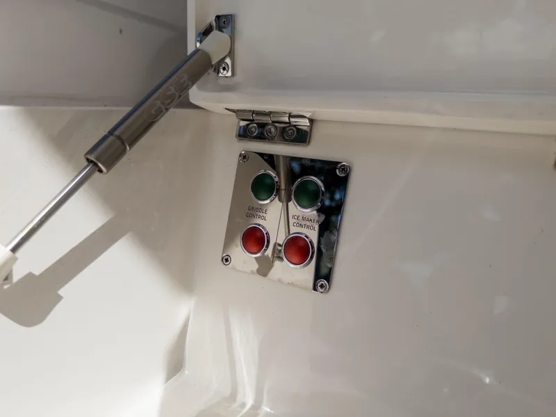 Slide: The Image of Control panel on 2020 Sunseeker Predator 74 yacht with buttons and hydraulic hinge. - 35