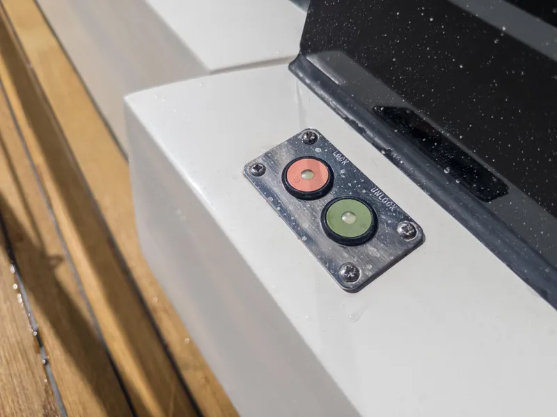 Slide: The Image of Sunseeker Predator 74 yacht control panel, 2020 model, featuring red and green buttons. - 37