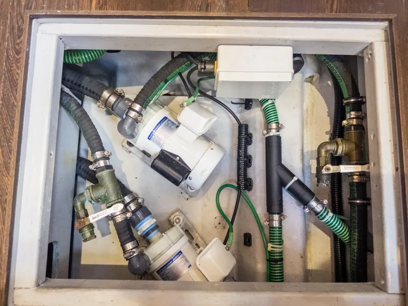 Slide: The Image of Engine compartment of 2020 Sunseeker Predator 74 yacht, showcasing mechanical components and hoses. - 45