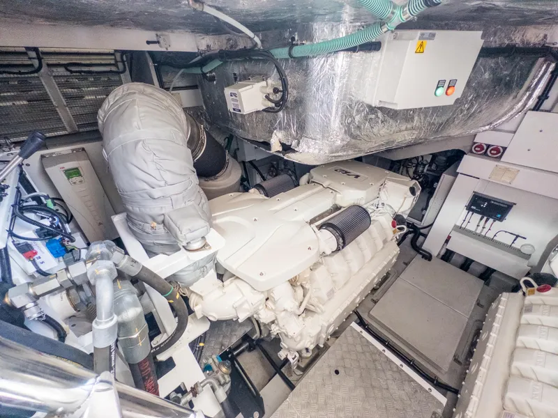 Slide: The Image of Engine room of 2020 Sunseeker Predator 74 yacht, showcasing advanced machinery and components. - 48