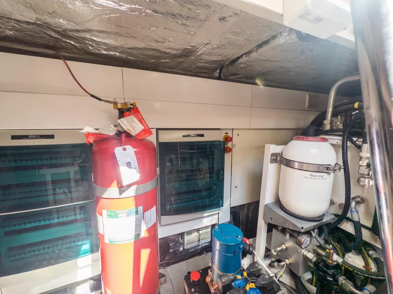 Slide: The Image of Engine room of 2020 Sunseeker Predator 74 yacht with equipment and fire extinguisher. - 49
