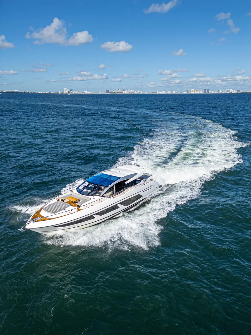 Slide: The Image of 2020 Sunseeker Predator 74 yacht cruising on open blue ocean. - 9