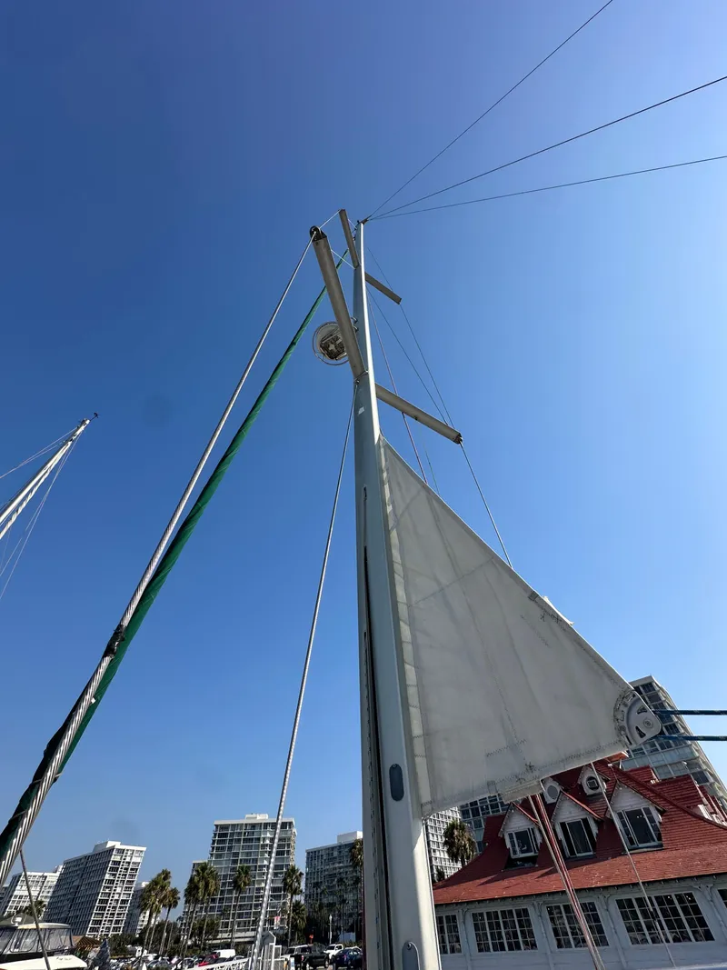 Slide: The Image of Sailboat mast and sail of 2011 Beneteau Oceanis 40 against clear blue sky. - 14