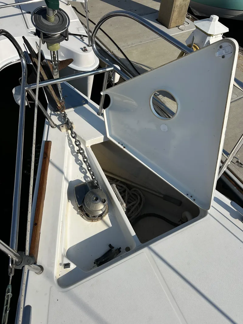 Slide: The Image of Beneteau Oceanis 40 (2011) anchor locker with open hatch and visible chain. - 16