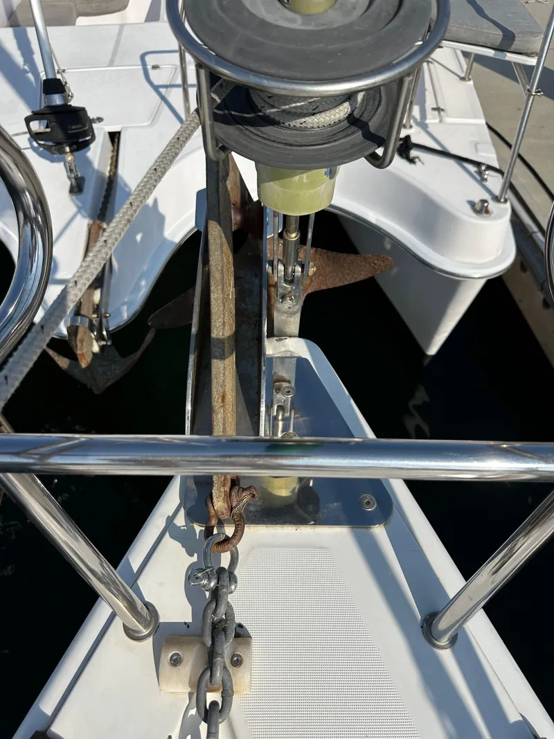 Slide: The Image of Bow of 2011 Beneteau Oceanis 40 sailboat with anchor and chain visible. - 18