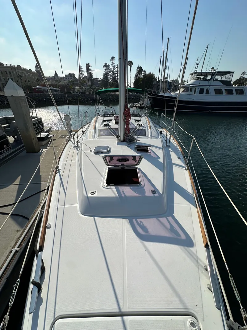 Slide: The Image of 2011 Beneteau Oceanis 40 sailboat docked in marina, viewed from deck. - 19