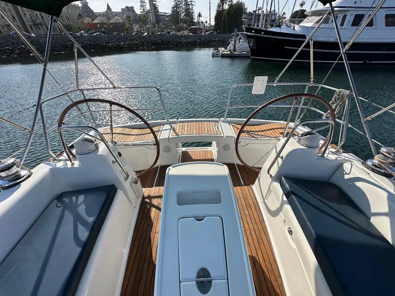 Slide: The Image of Beneteau Oceanis 40 sailboat cockpit with dual steering wheels, 2011 model, docked in marina. - 26