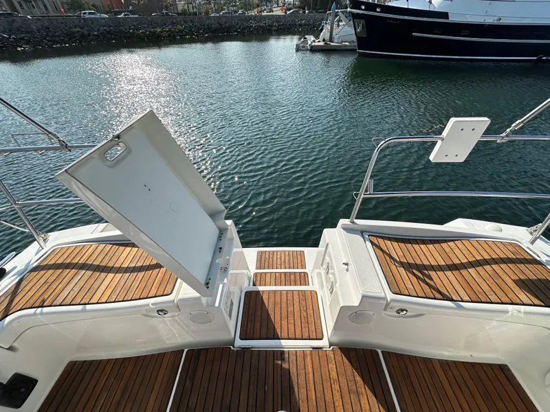 Slide: The Image of Beneteau Oceanis 40 yacht deck, 2011 model, with open hatch and wooden flooring. - 28