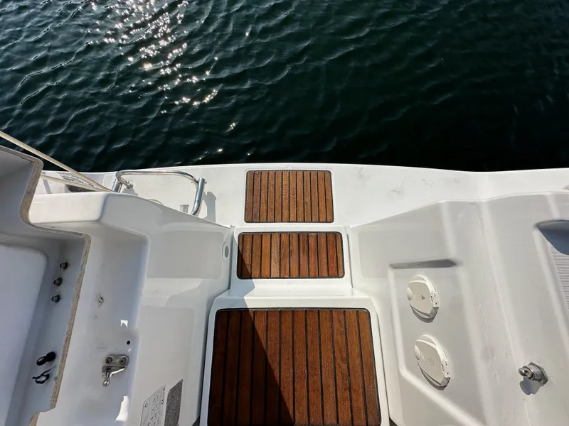Slide: The Image of Teak deck of 2011 Beneteau Oceanis 40 sailboat with water view. - 29