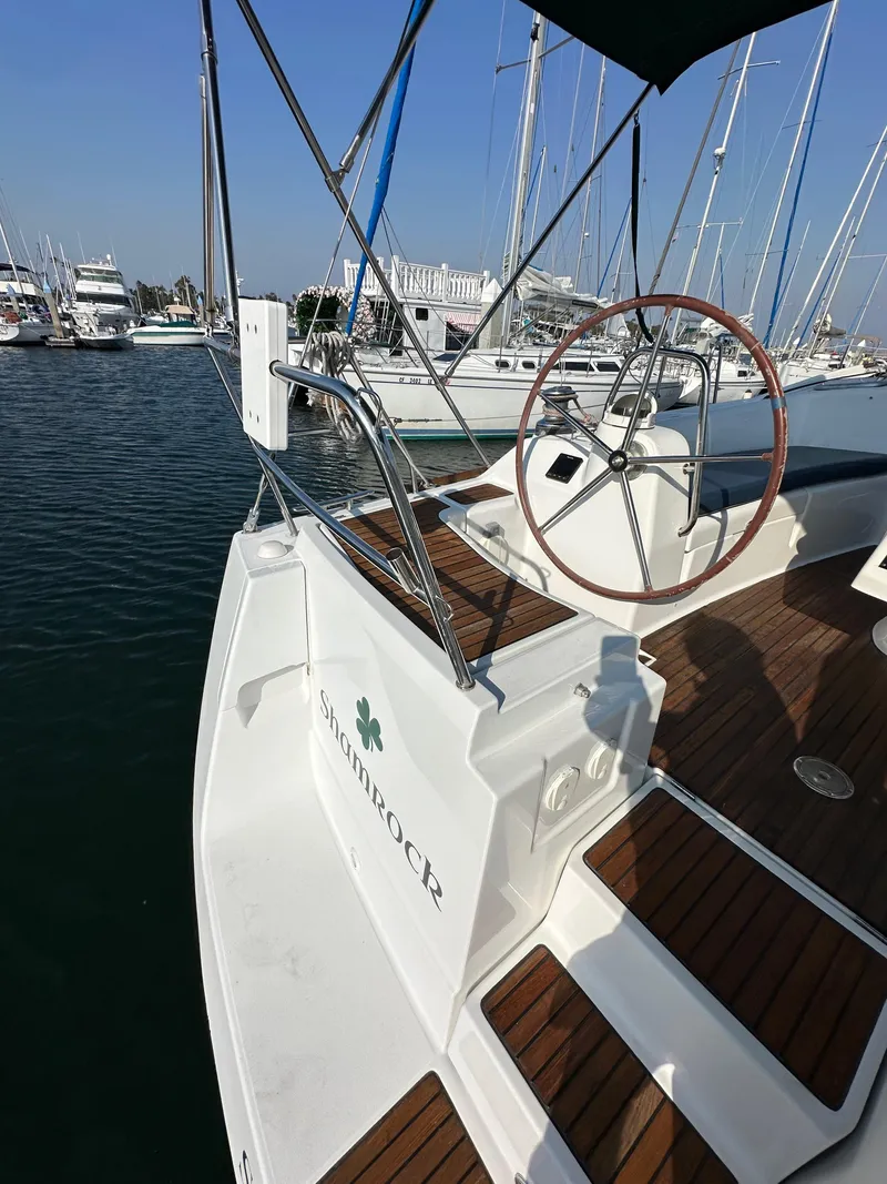 Slide: The Image of 2011 Beneteau Oceanis 40 sailboat with wooden deck, docked in marina. - 31