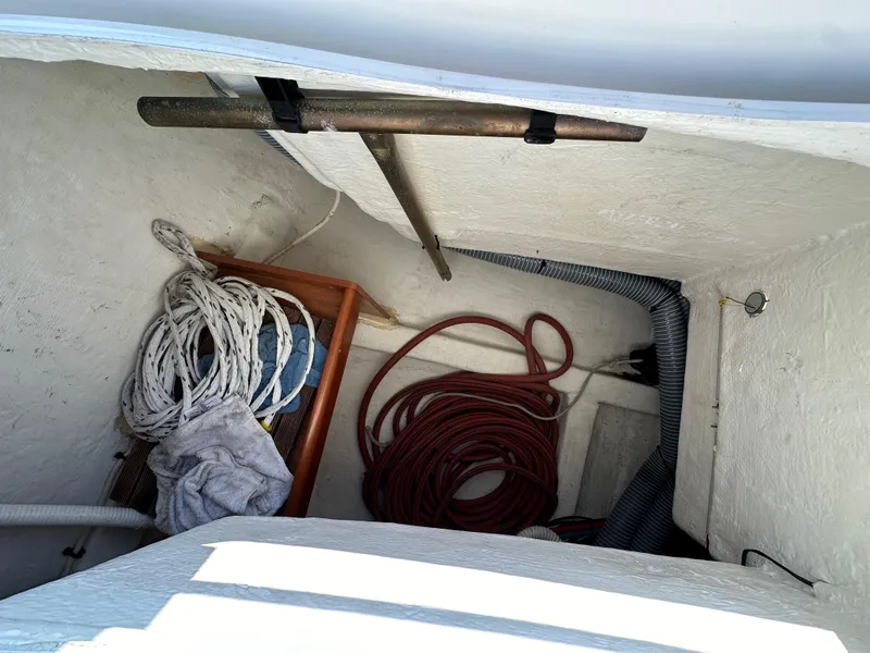 Slide: The Image of Storage compartment of 2011 Beneteau Oceanis 40 with ropes and equipment. - 38