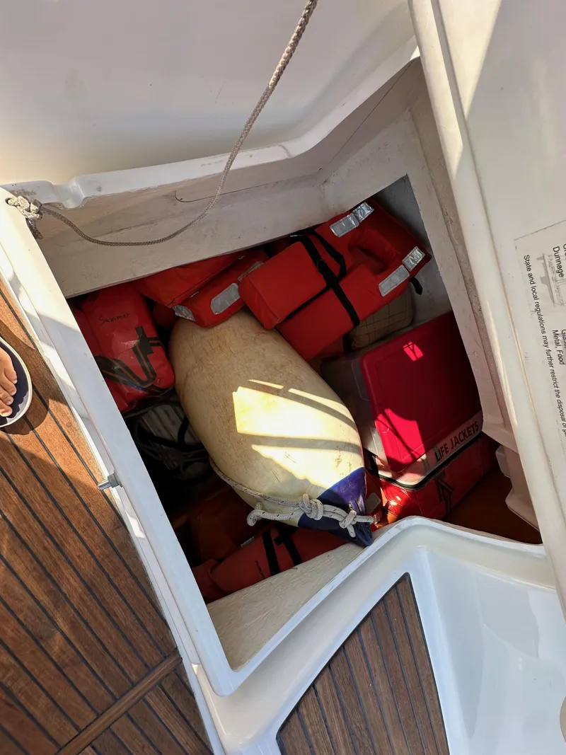 Slide: The Image of Storage compartment on 2011 Beneteau Oceanis 40 sailboat with life jackets and equipment. - 43
