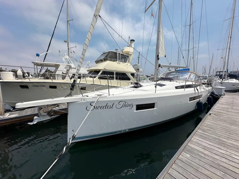 Slide: The Image of 2020 Jeanneau Sun Odyssey 410 sailboat docked at marina, named "Sweetest Thing". - 16