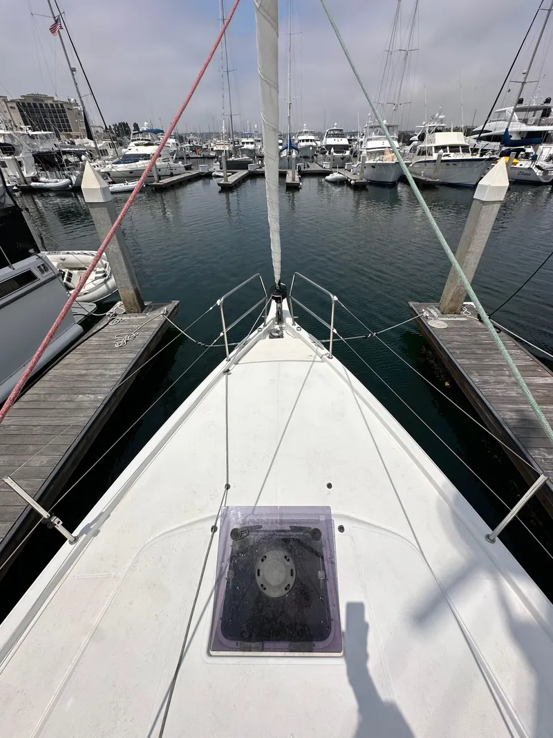 Slide: The Image of Jeanneau Sun Odyssey 410 sailboat docked in marina, 2020 model, view from bow. - 28