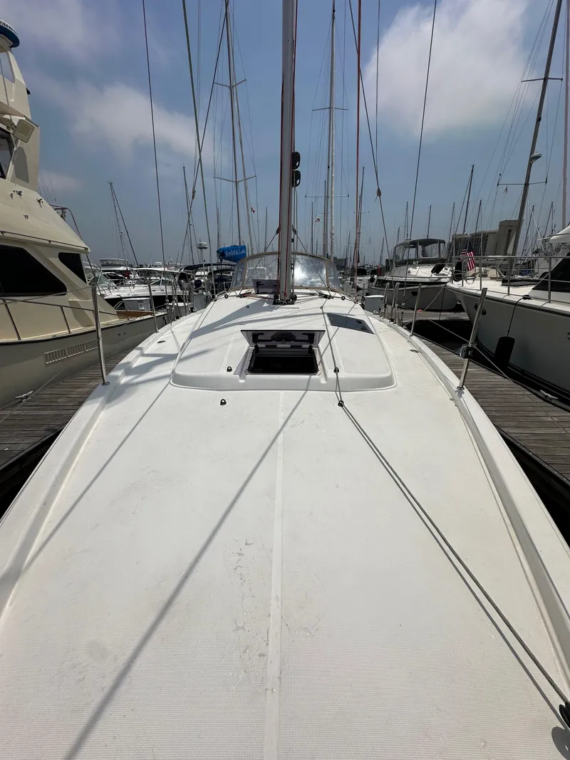 Slide: The Image of 2020 Jeanneau Sun Odyssey 410 sailboat docked at marina, view of deck and mast. - 32