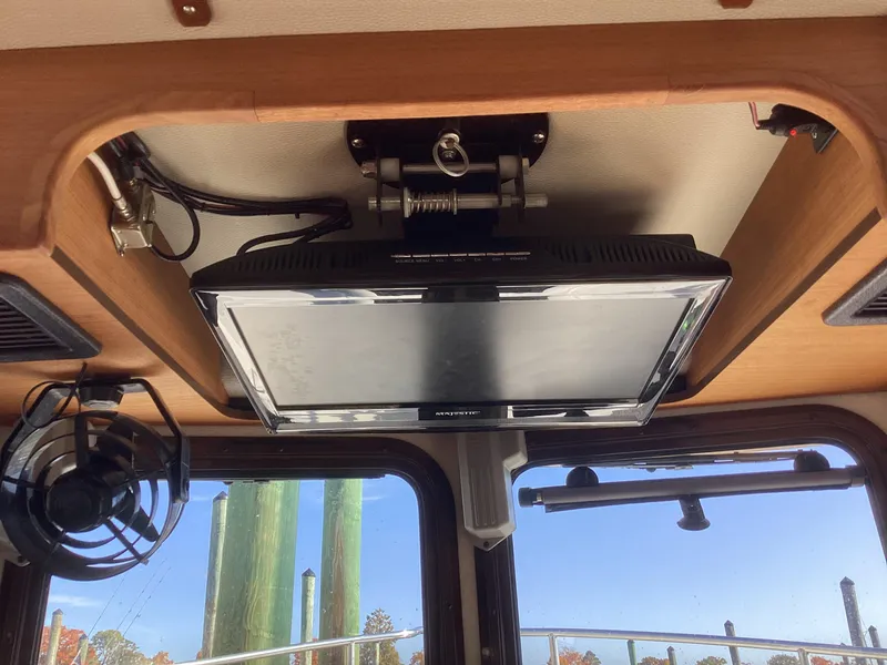Slide: The Image of Ceiling-mounted TV in 2012 Ranger Tugs R-27 boat interior. - 17