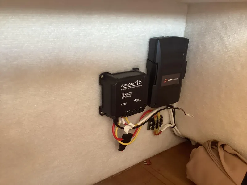 Slide: The Image of 2012 Ranger Tugs R-27 electrical components with wiring and ProMariner ProSport 15 charger. - 27