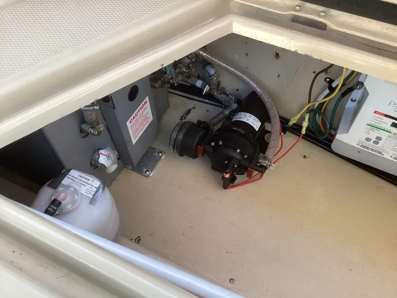 Slide: The Image of 2012 Ranger Tugs R-27 engine compartment with wiring and components. - 30