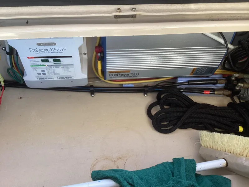 Slide: The Image of 2012 Ranger Tugs R-27 engine compartment with ProNautic charger and TruePower inverter. - 31