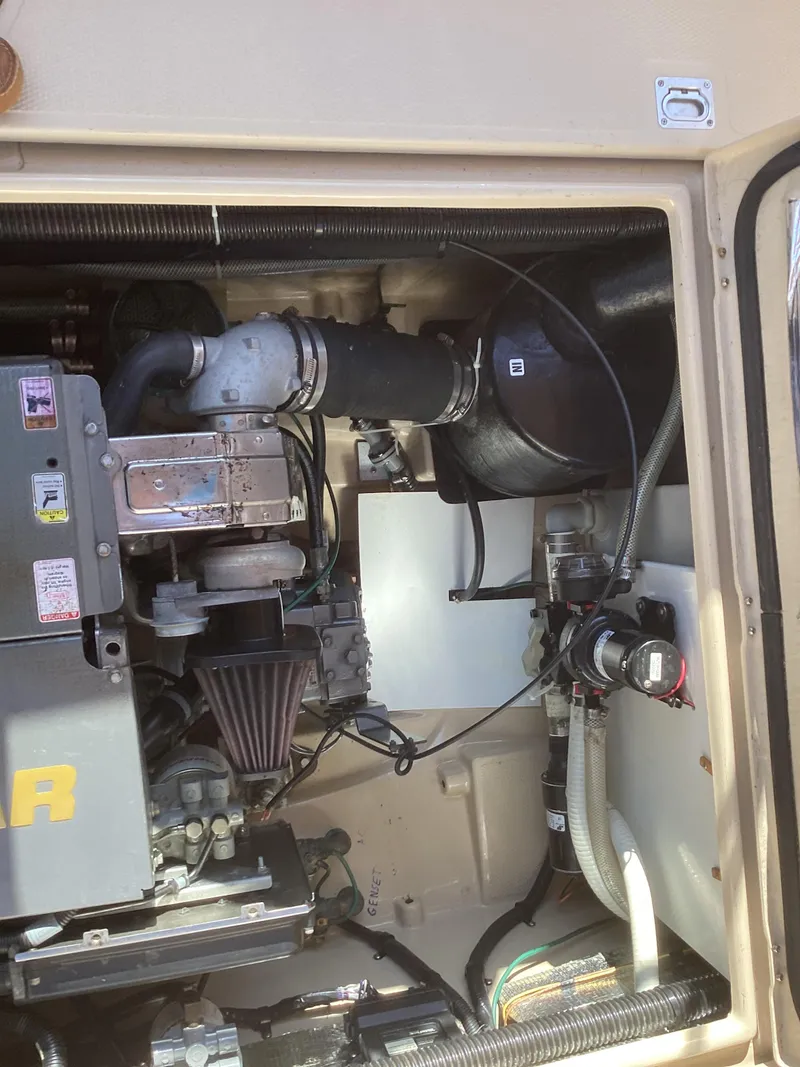 Slide: The Image of Engine compartment of 2012 Ranger Tugs R-27 boat, showcasing mechanical components. - 36
