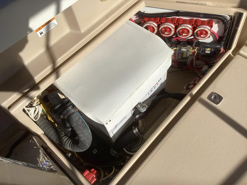 Slide: The Image of 2012 Ranger Tugs R-27 engine compartment with electrical components and wiring. - 43