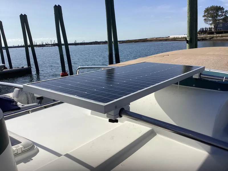 Slide: The Image of Solar panel on 2012 Ranger Tugs R-27 boat docked by the water. - 7