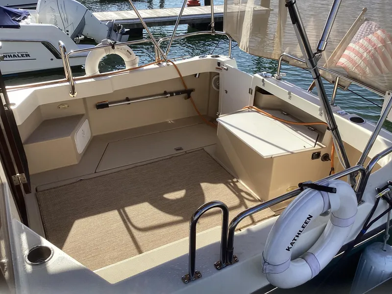 Slide: The Image of 2012 Ranger Tugs R-27 boat interior with seating and life preserver. - 8