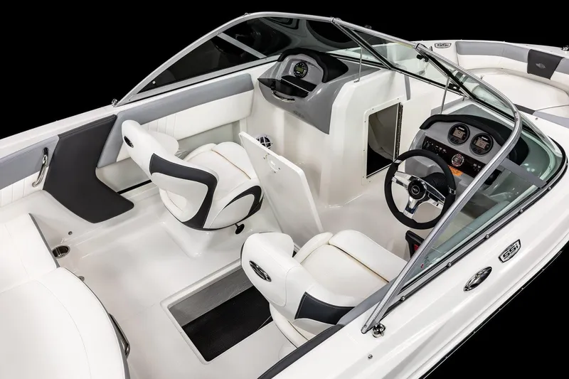 Slide: The Image of 2025 Chaparral 19 SSi OB boat interior with sleek white seating and modern dashboard. - 10