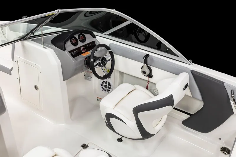 Slide: The Image of 2025 Chaparral 19 SSi OB boat interior with steering wheel and seating. - 12