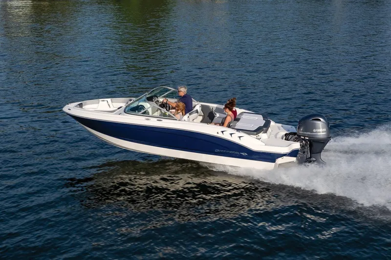 Slide: The Image of 2025 Chaparral 19 SSi OB speedboat cruising on a calm lake. - 4