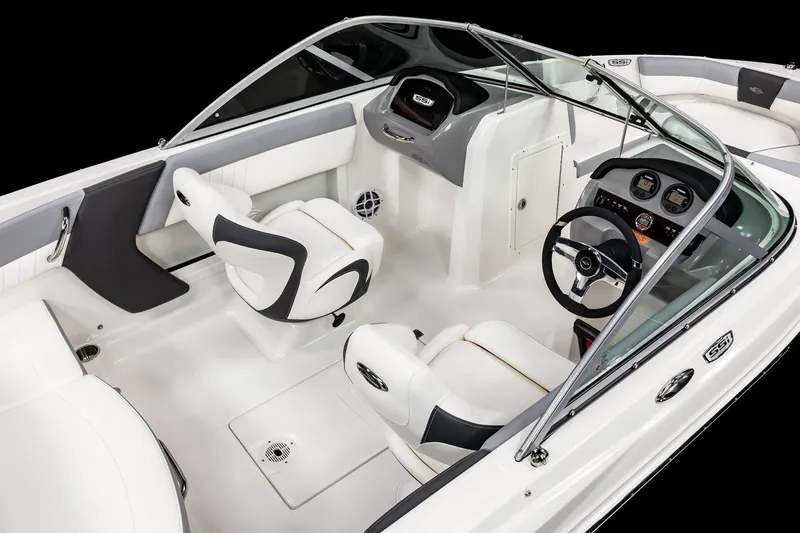 Slide: The Image of 2025 Chaparral 19 SSi OB boat interior with sleek white seating and modern dashboard. - 9